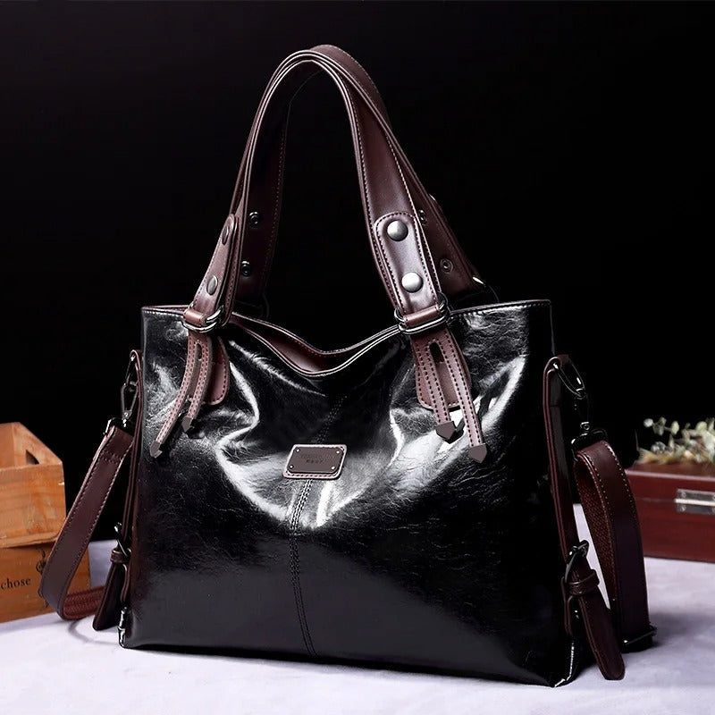 Olijfgroene vintage leren schoudertas voor dames, ruim, zacht en elegant, perfect als handtas.