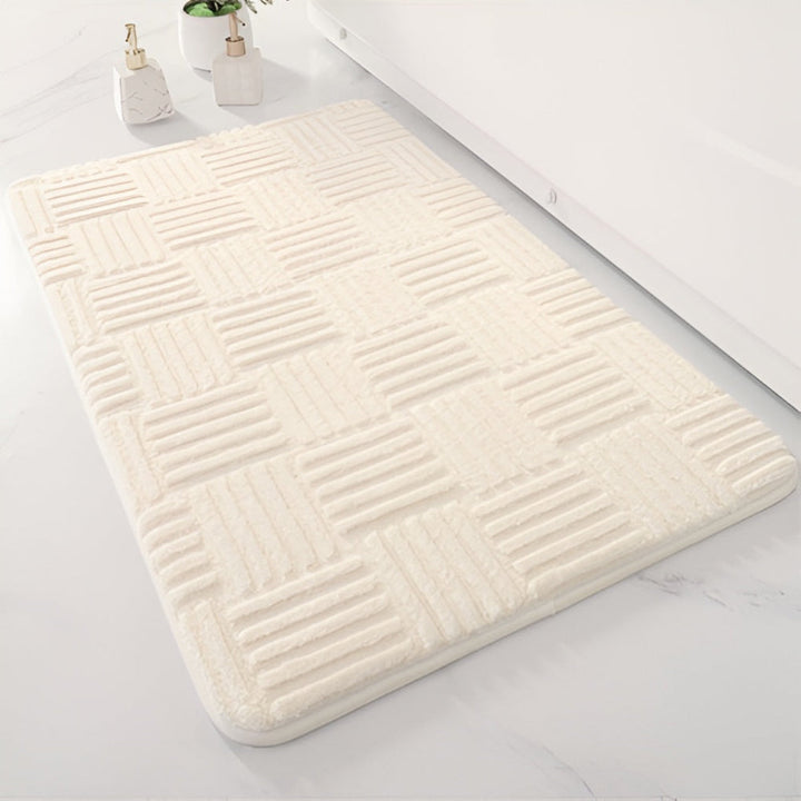 Zacht shaggy badkamerkleed van katoen, ideaal voor luxe badkamerdecoratie en comfort onder de voeten.