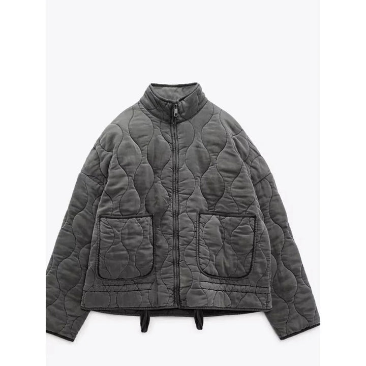 Close-up van de rits en stof van de warme dames winterjas. Comfortabel en elegant vintage design.