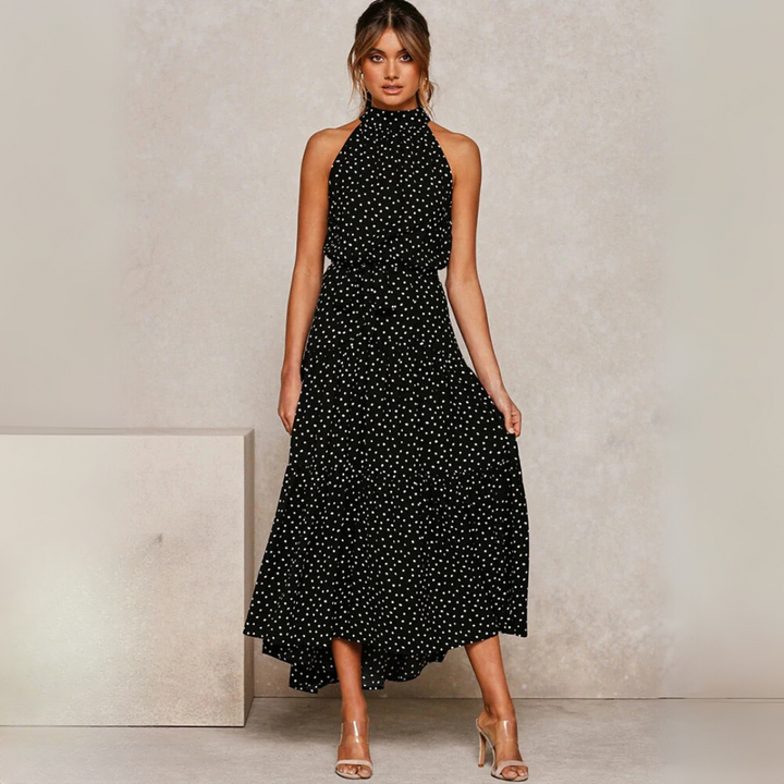 Zomerse dames midi-jurk met stippenprint in boho stijl, luchtig en comfortabel voor strand of stad.