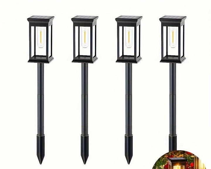 Set van 4 solar tuinlampen, ideaal voor energiezuinige buitenverlichting van tuinpaden en borders.