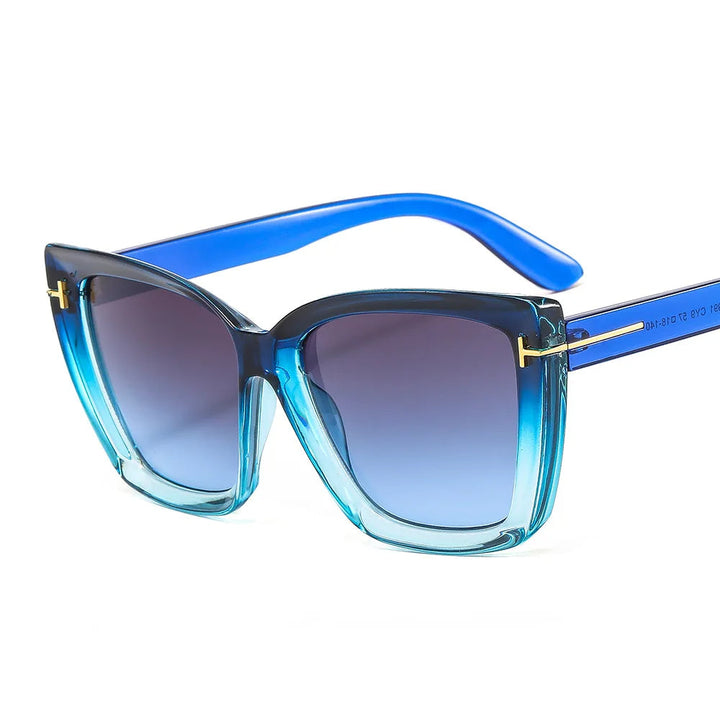 Dames cat-eye zonnebril met verloopglazen, trendy vorm, en UV400 bescherming voor een modieuze look.