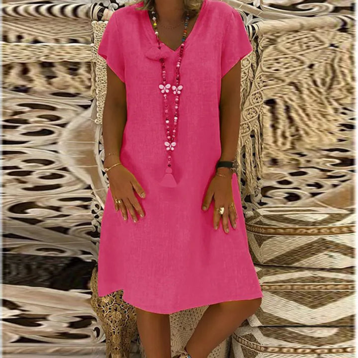 Losvallende dames midi-jurk met stijlvolle V-hals en kapmouwen. Ideale comfortabele casual zomerjurk.