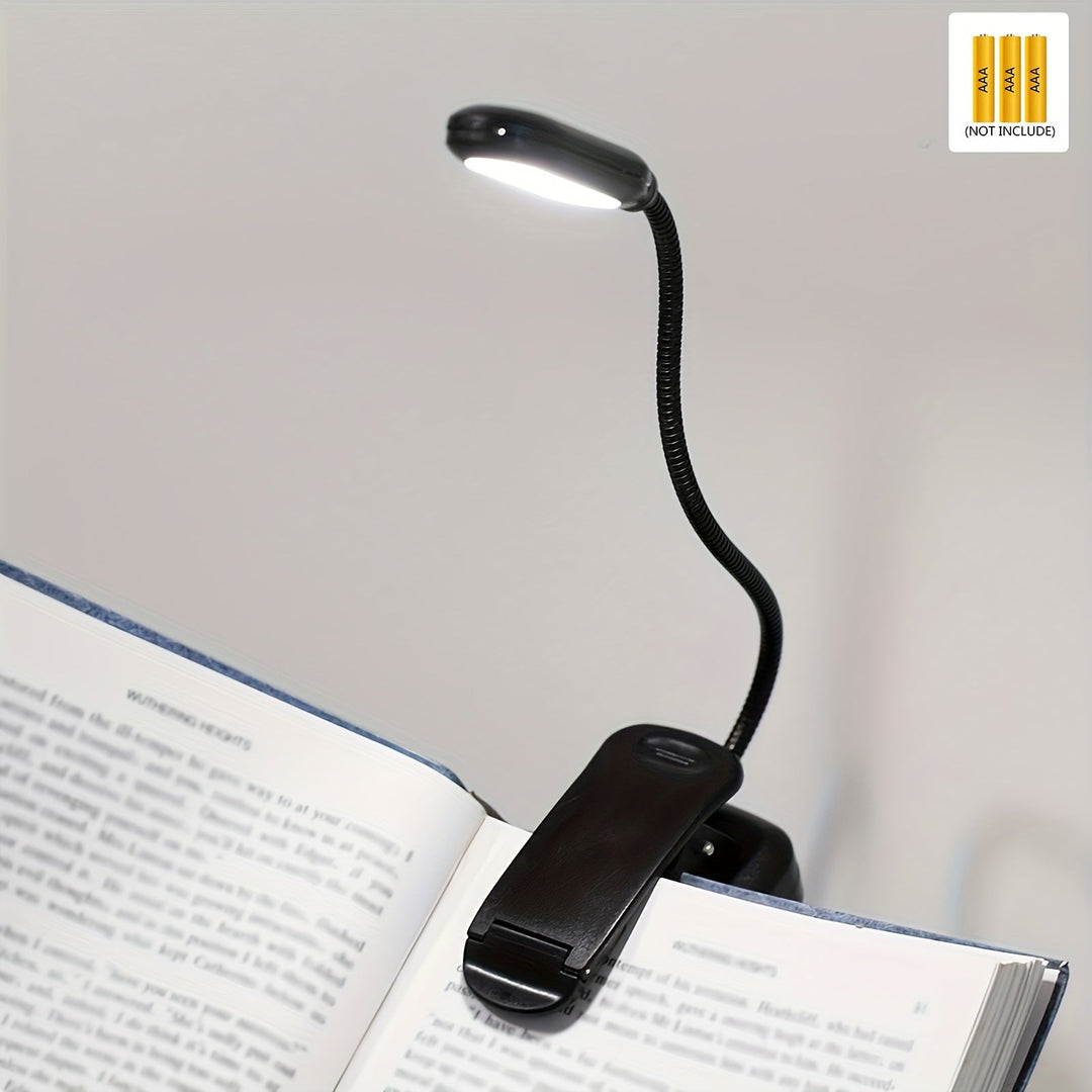 Draagbare leeslamp met flexibele hals en clipbevestiging, perfect voor comfortabel lezen in bed.
