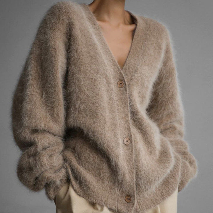 Warm acryl dames knoopvest, zacht gebreid voor de winter. Een comfortabele en modieuze keuze voor vrouwen.