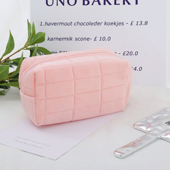Compacte dames make-up tas in Japanse kussen stijl, ideaal als toilettas of reisorganizer. Gewatteerd.