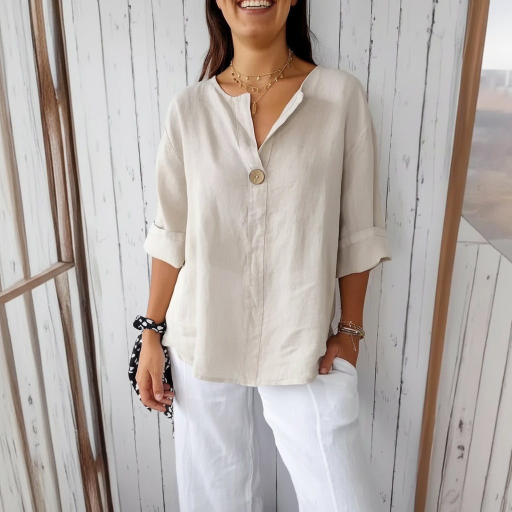 Dames comfortabel wit V-hals T-shirt met lange mouwen en losse pasvorm, ideaal voor een casual of elegante look.