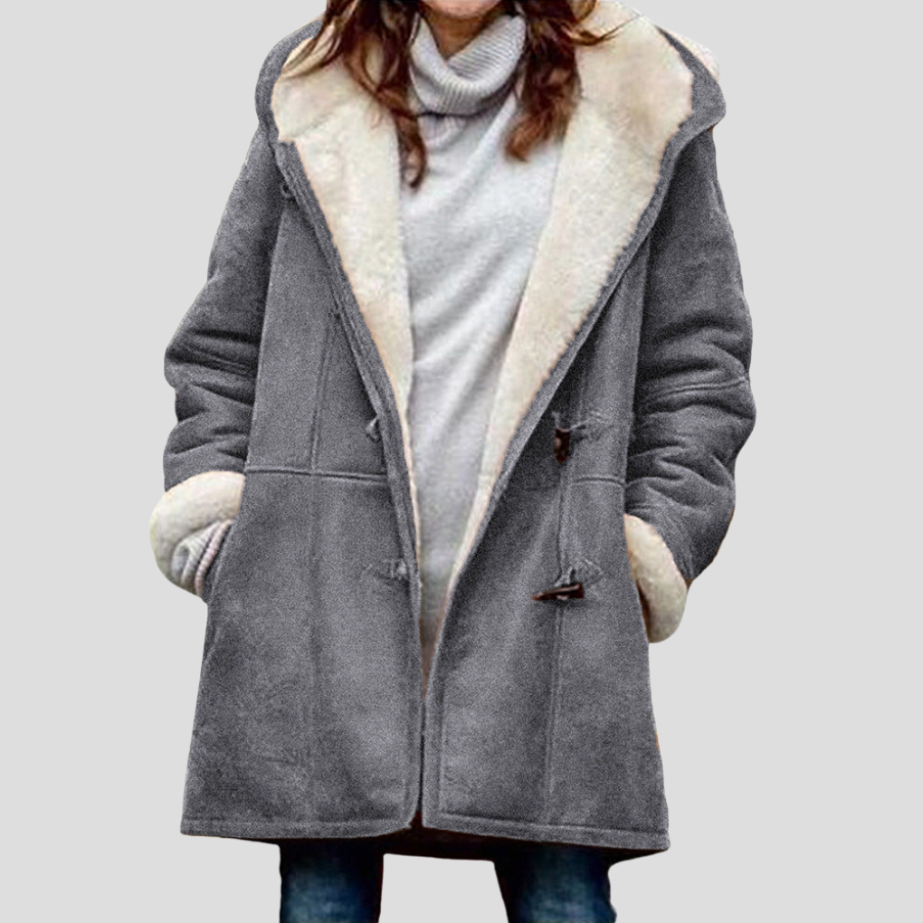 Comfortabele bruine damesjas met opstaande kraag, een essentieel kledingstuk voor de lente en herfst.