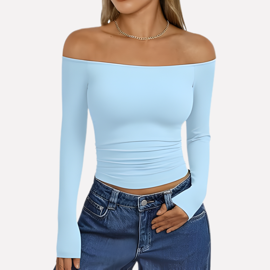 Veelzijdige damestop met off-shoulder halslijn en lange mouwen, geschikt voor elke modieuze gelegenheid.