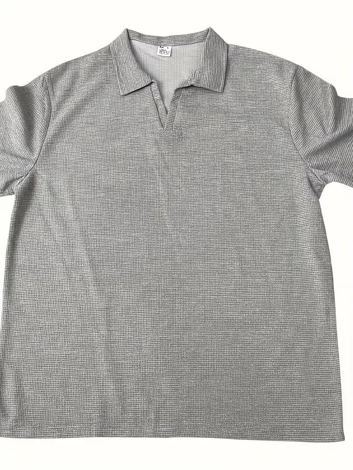 Stijlvolle herenpolo, korte mouw, V-hals en trendy wafelstructuur, voor een relaxte look.