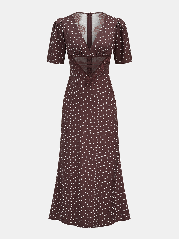 Veelzijdige dames midi-jurk met speelse stippenprint en V-hals. Een perfecte elegante zomerjurk.