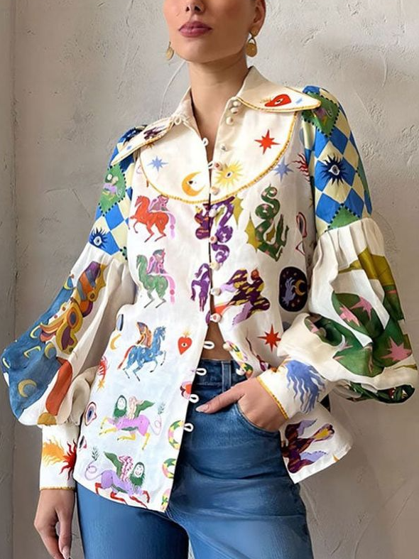 Dames pop-art blouse met levendige kunstprint en trendy pofmouwen, perfect voor een casual statement look.