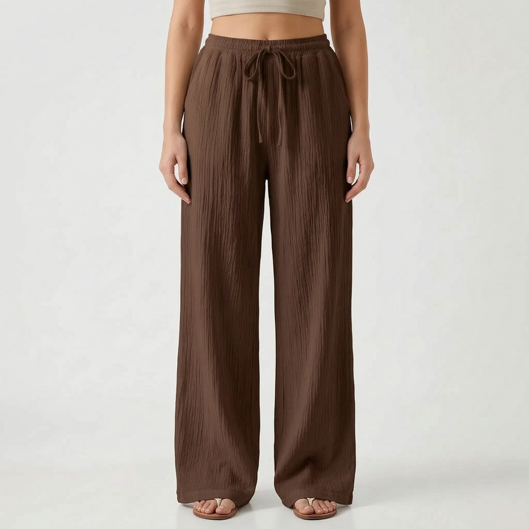 Zomerse dames palazzo broek met wijde pijpen en elastische taille, voor een luchtige en modieuze uitstraling.