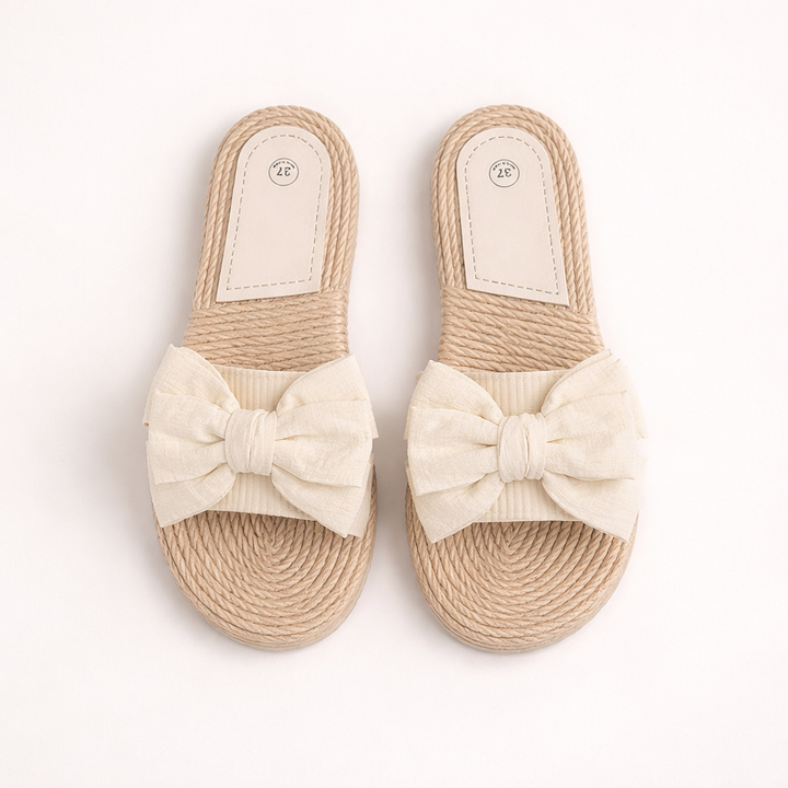Elegante dames platte sandalen met decoratieve strik, ideaal voor comfortabele zomer casual mode.