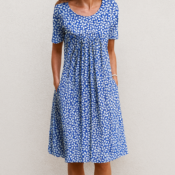 Midi dames zomerjurk van katoenmix met bloemenruffles, perfect voor een moeiteloze en elegante zomerlook.