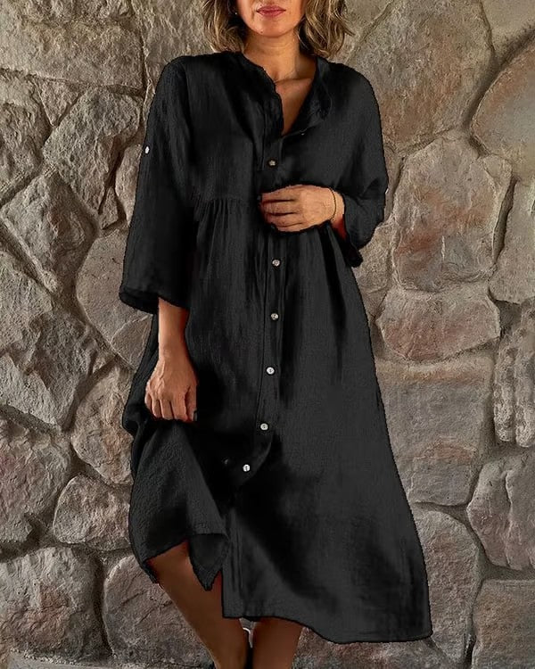Modieuze zwarte midi jurk voor dames, perfect als elegante zomerjurk met comfortabel flatterend silhouet en 3/4 mouwen.