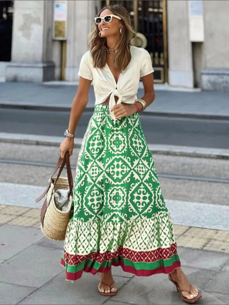 Dames Liora midi rok met vrolijke retro print, perfect voor een stijlvolle zomeroutfit of casual dagjes uit.