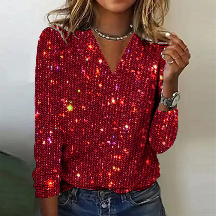 Chique damesblouse met V-hals, vol fonkelende pailletten. Perfecte feestkleding en sprankelende avondmode.