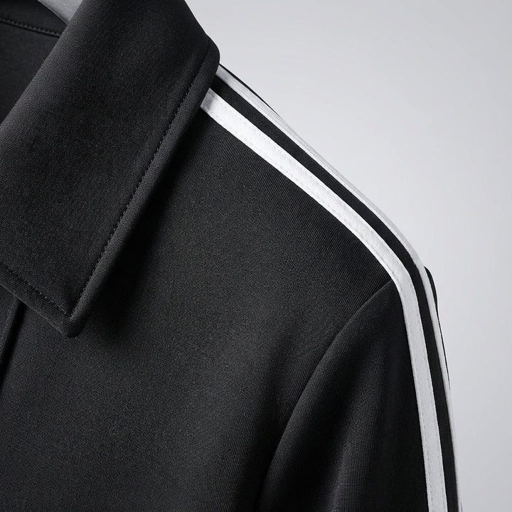Zwart-wit heren trainingsjack Marshall, gevoerd. Stijlvolle sportkleding voor training en vrije tijd.