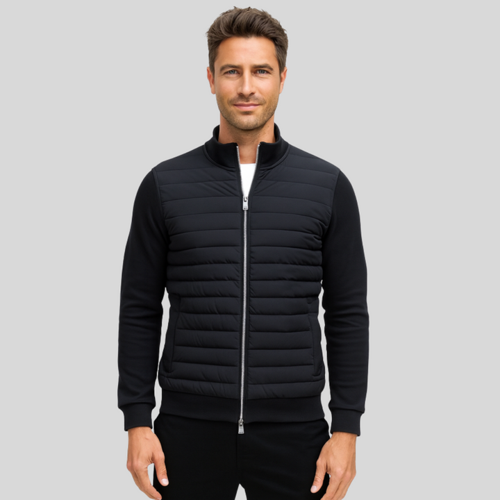 Marineblauwe heren gewatteerde jas met ritssluiting, ideaal als stijlvolle winter- of herfstjas.
