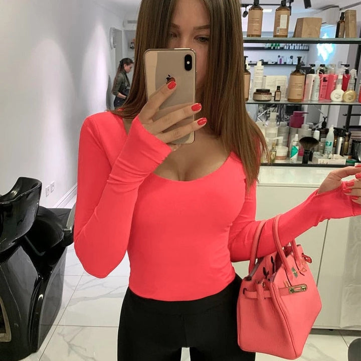 Damesbody met lange mouwen, ideaal als basisshirt, combineert comfort met een chique uitstraling.