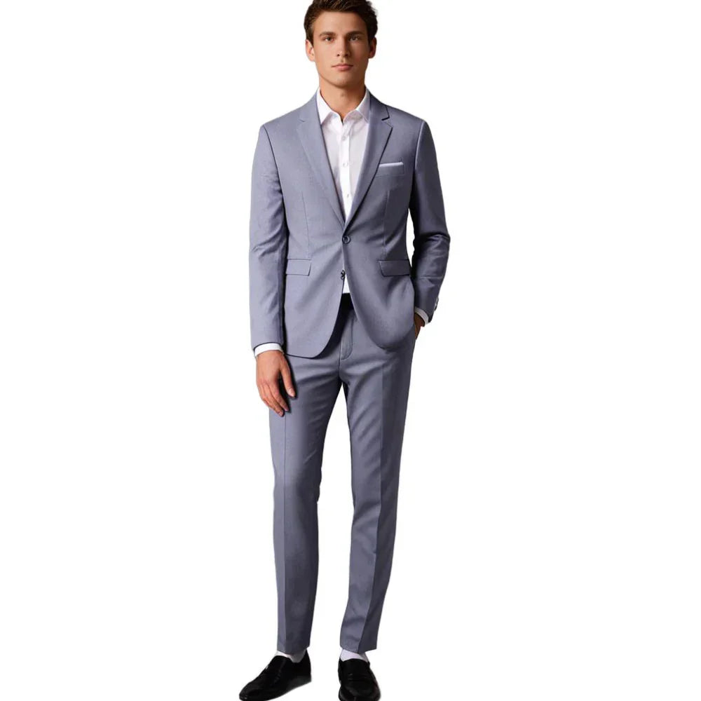 Man draagt een compleet Hoymans herenpak: elegant colbert en comfortabele broek, staand model.