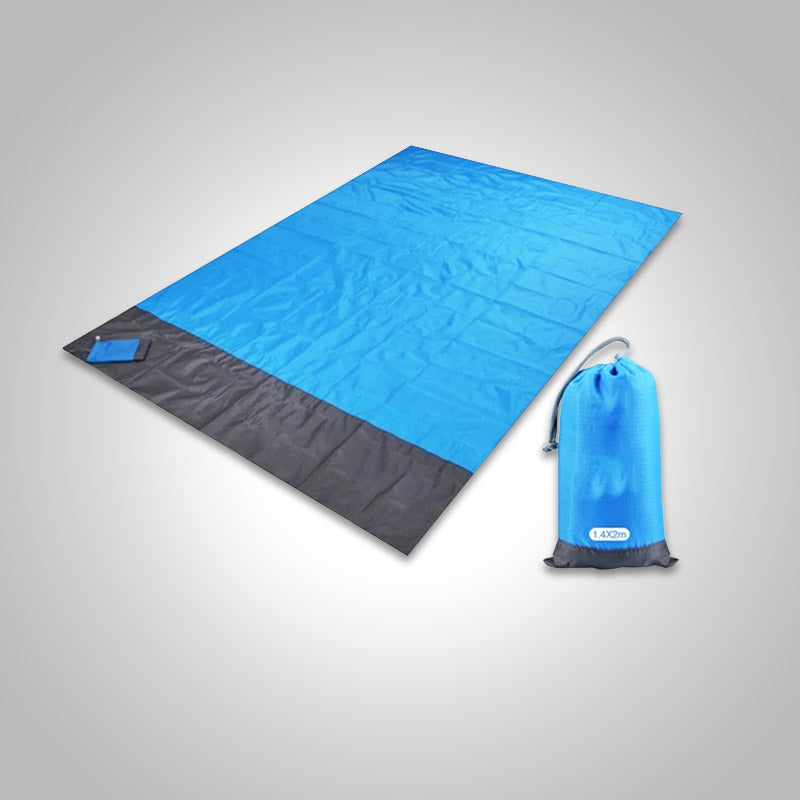 Zandvrije strandmat; ideaal voor zomerse dagen aan zee. Comfortabel en lichtgewicht.