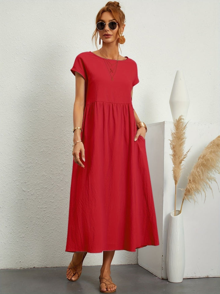 Stijlvolle dames zomerjurk, midi lengte, korte mouwen en comfortabele pasvorm voor veelzijdig gebruik.