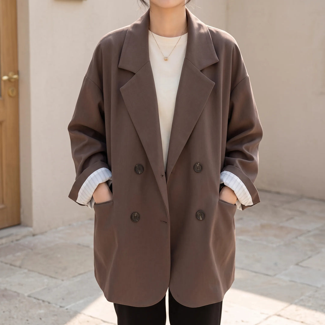 Dames oversized double-breasted blazer, ideaal voor een elegante smart-casual of zakelijke look. Zwart colbert.