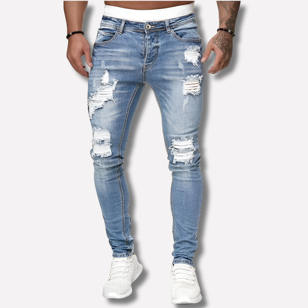 Stijlvolle slim fit gescheurde heren spijkerbroek. Perfecte streetstyle jeans voor een moderne, casual look.