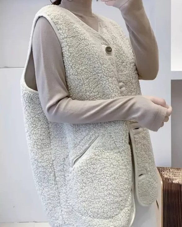 Effen wollen damesvest, warm en stijlvol, een must-have voor de koude dagen.
