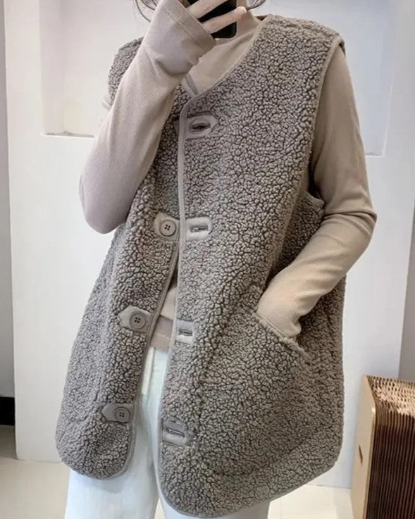 Dames wollen gilet, effen en mouwloos, perfect voor een stijlvolle winterse look.