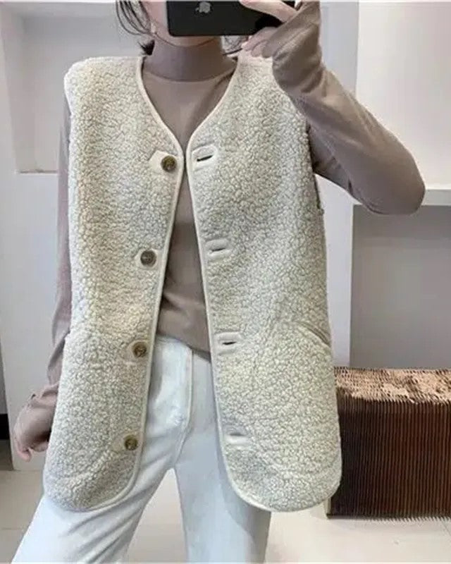 Comfortabel mouwloos wollen gilet, effen design, essentieel voor de winter.
