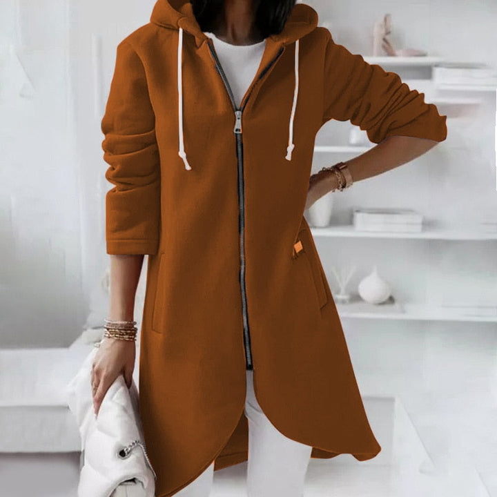 Veelzijdige dames herfstjas met capuchon, middellang silhouet, casual en modern design.