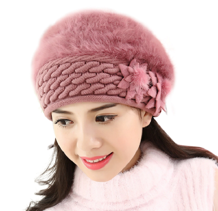 Close-up van gebreide dames wintermuts, zachte textuur, effen katoen, warm en knus.