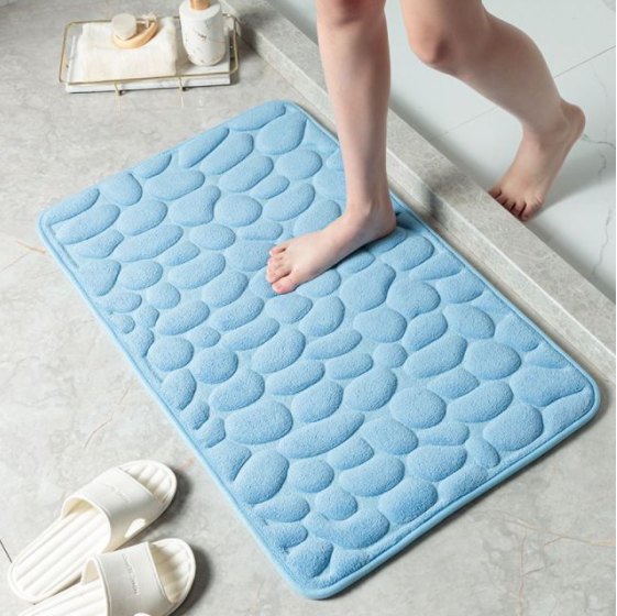 Waterabsorberende douchemat, antislip en zacht; essentieel voor een veilige en comfortabele badkamer.