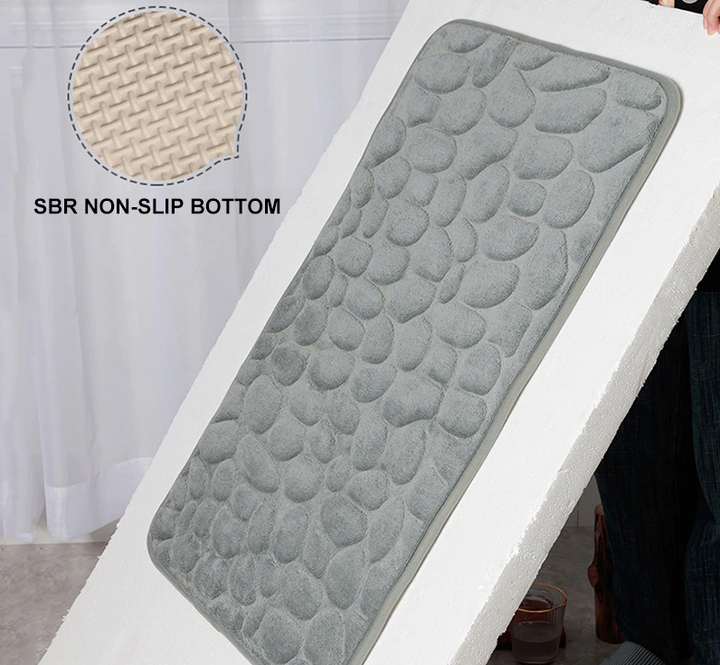 Duurzame antislip badmat van traagschuim; biedt zacht comfort en optimale veiligheid in de badkamer.
