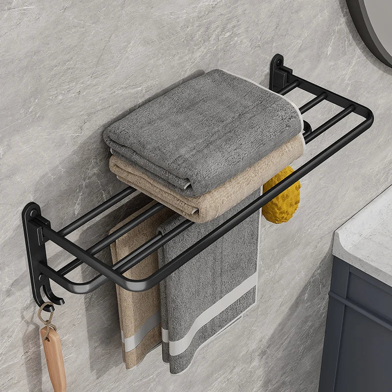 Duurzaam mat zwart inklapbaar handdoekenrek van staal, compact en modern badkameraccessoire voor efficiënt opbergen.