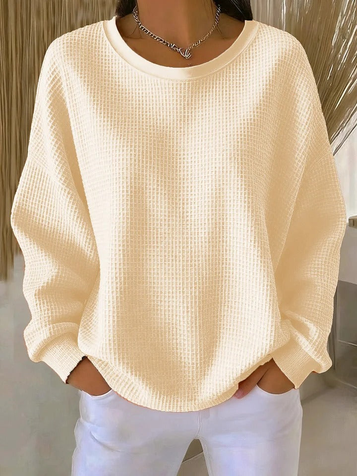 Zachte, gebreide dames trui met rijke textuur, biedt comfort en stijl. Essentieel item voor de casual garderobe.