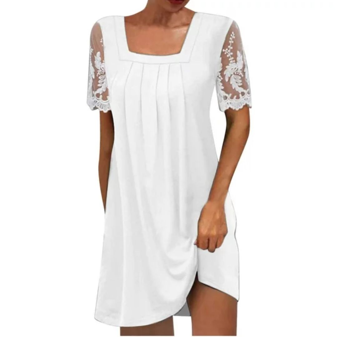 Tijdloze witte dames jurk in klassieke stijl, ideaal als feestjurk of zomerjurk.
