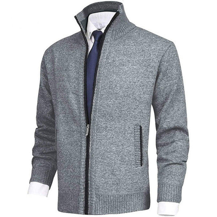 Detail van de elastische zoom en manchet van dit comfortabele herenvest met rits. Kwaliteitsvolle mannenmode.
