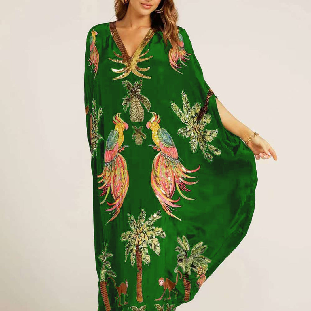 Dames wijde enkellange kaftan met levendige tropische print. Perfecte strandjurk voor vakantie.