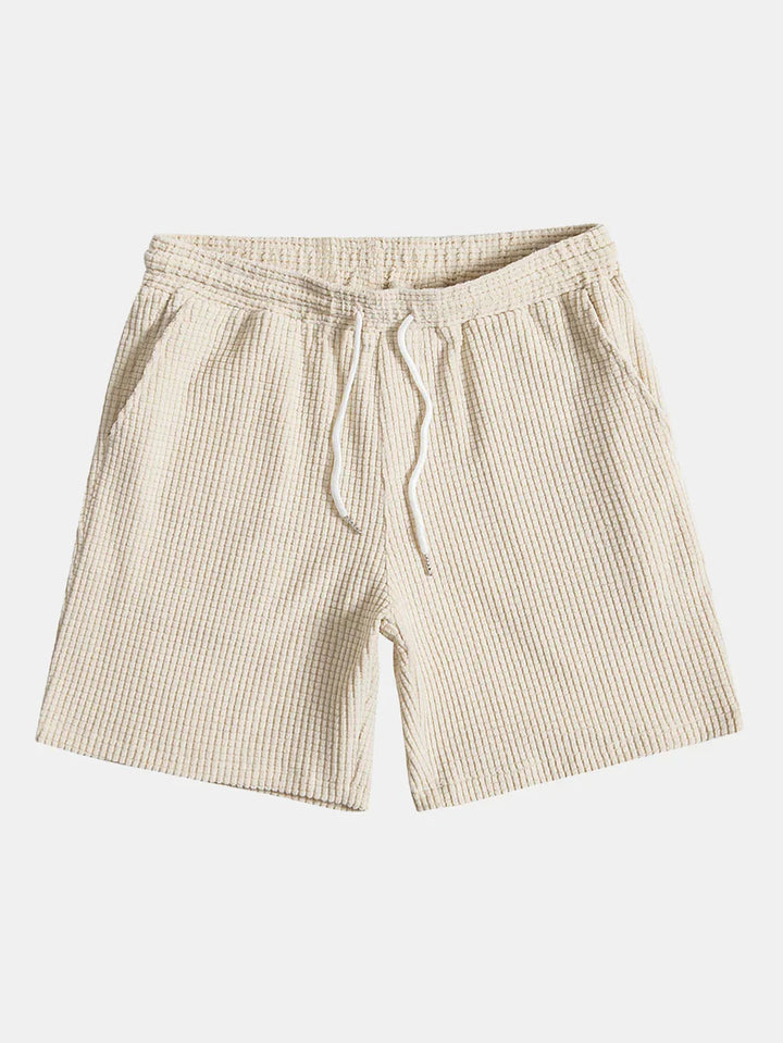 Close-up van het ribpatroon op deze comfortabele heren zomerset. Casual shirt en short detail.