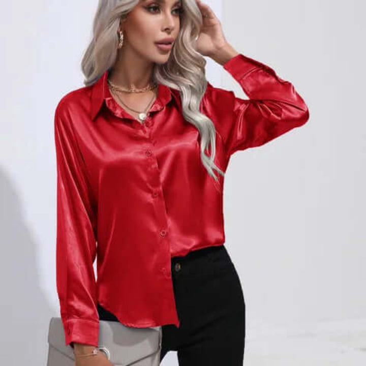 Glanzende dames top met lange mouwen en losse pasvorm, perfect voor een chique look.
