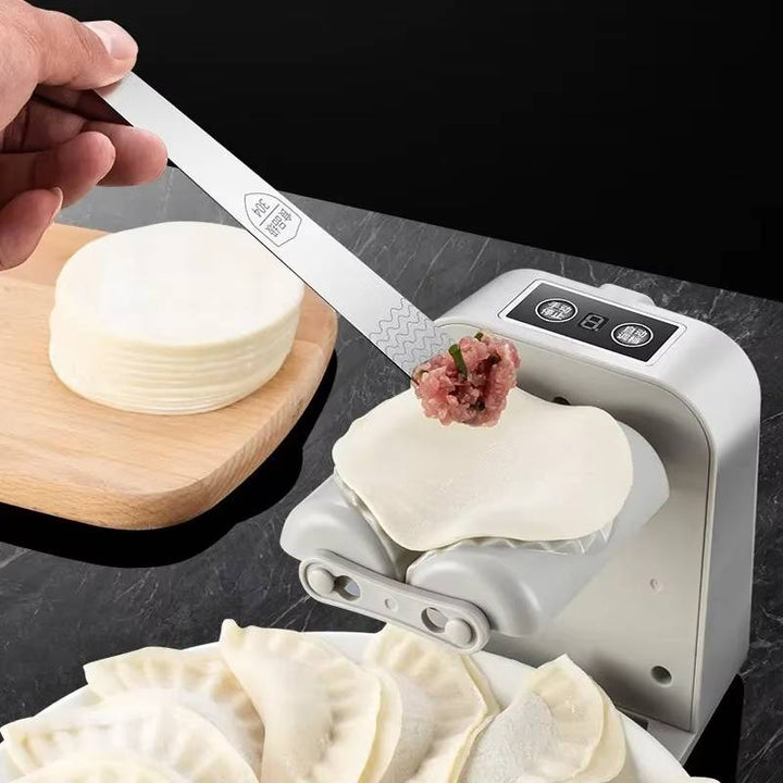Compacte automatische dumplingmaker, perfect voor gemakkelijk en snelle voedselbereiding in elke keuken.