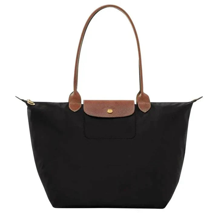 Modieuze dames schoudertas, kunstleer, met verstelbare bandjes. Een chique accessoire voor elke outfit.