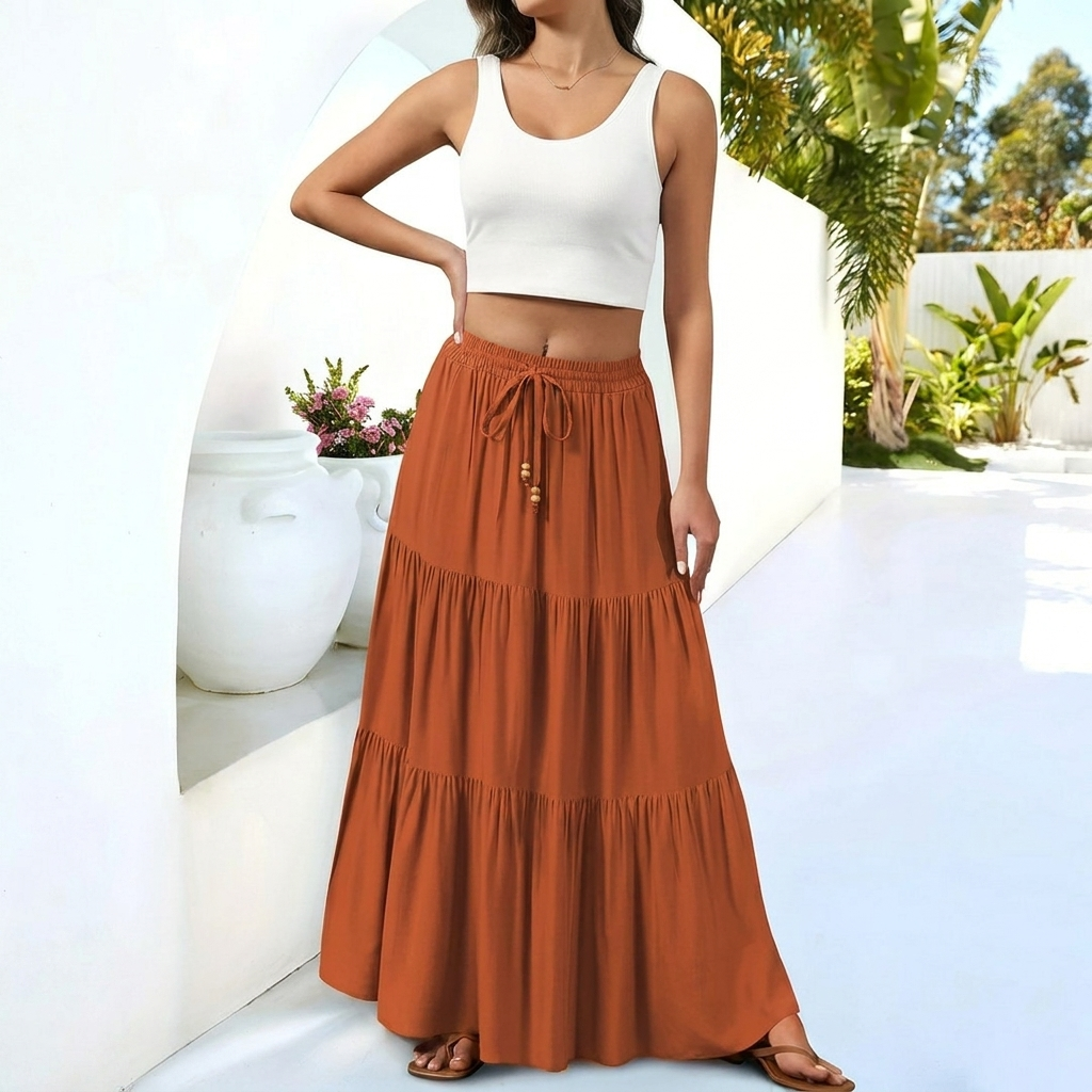Luchtige oranje dames maxi A-lijn rok met hoge taille, perfect voor strandmode en zomerse casual outfits.