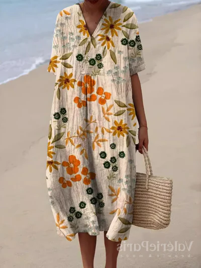 Comfortabele strandjurk voor dames, met vrolijk bloemmotief en luchtige stof.