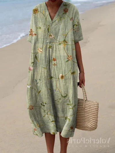 Elegante damesjurk met bloemmotief, ideaal als strandjurk of voor warme zomerdagen.