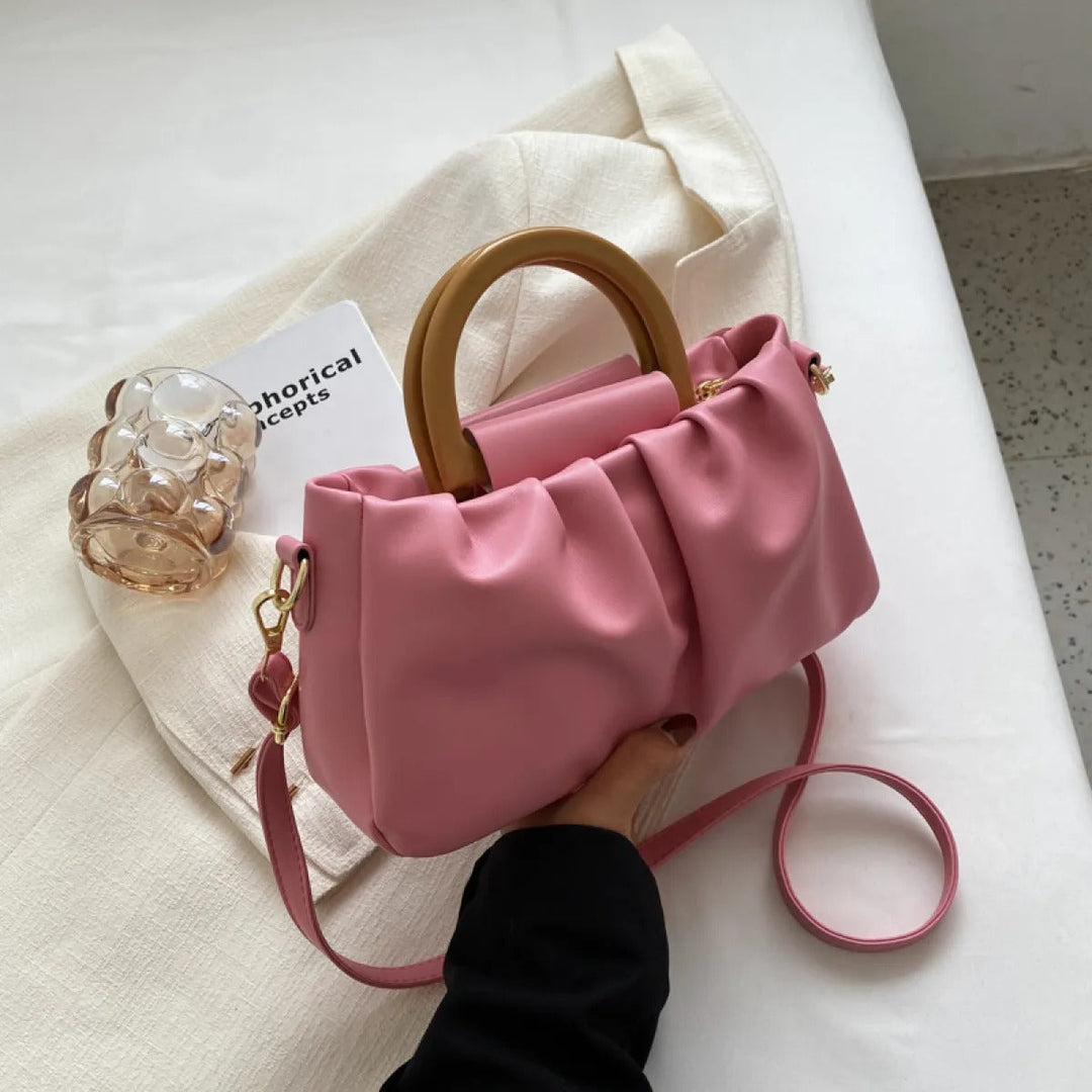 Moderne dames handtas met unieke ruches, een elegante schoudertas die stijl en comfort combineert.